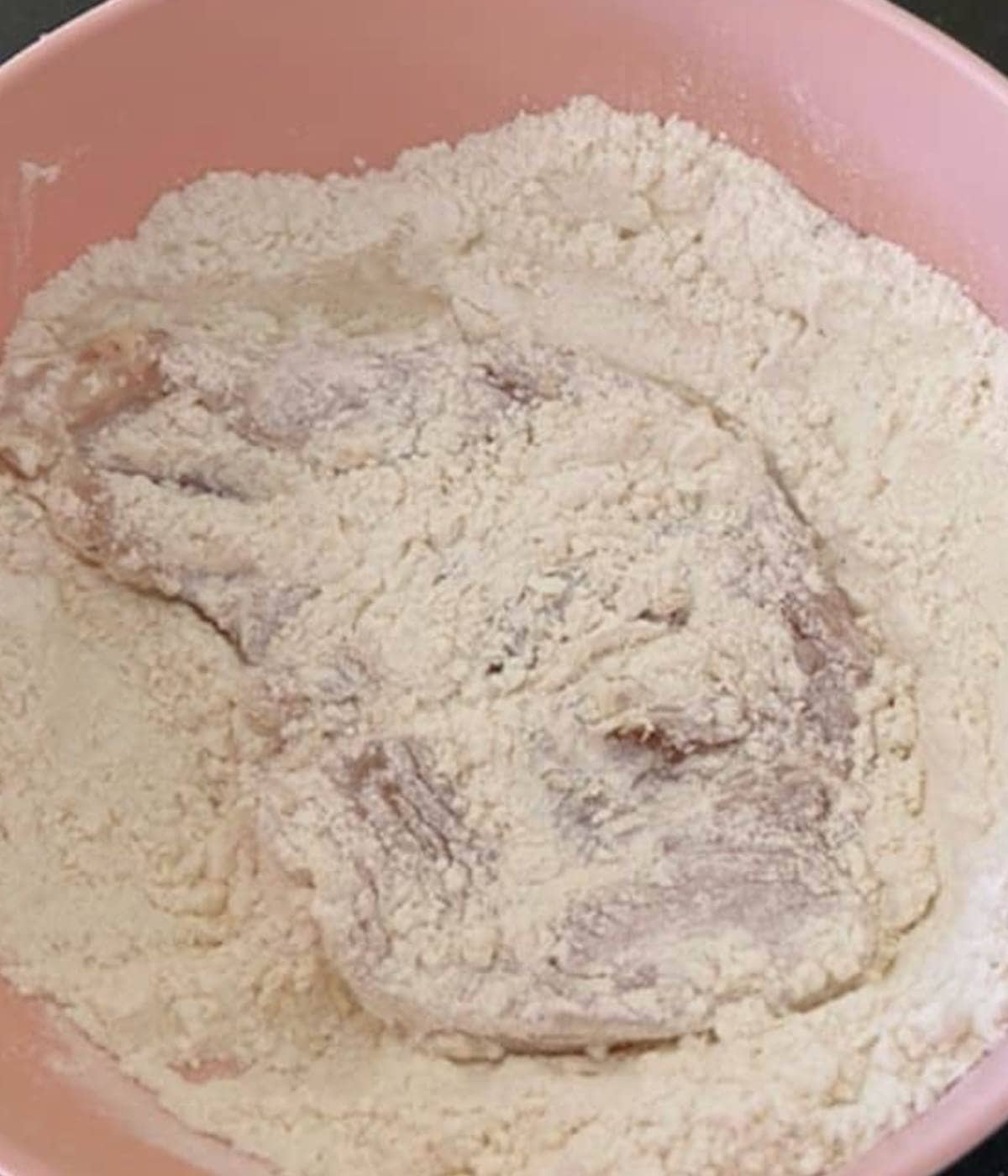 Chicken breast in flour.