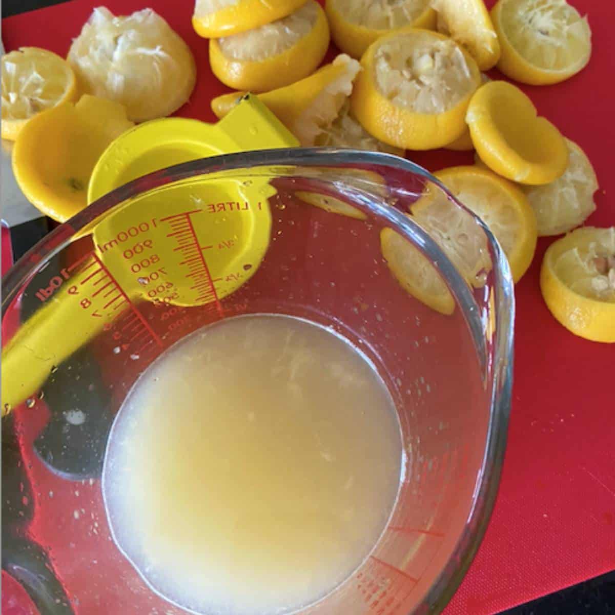 Fresh lemon juice in pyrex dish.