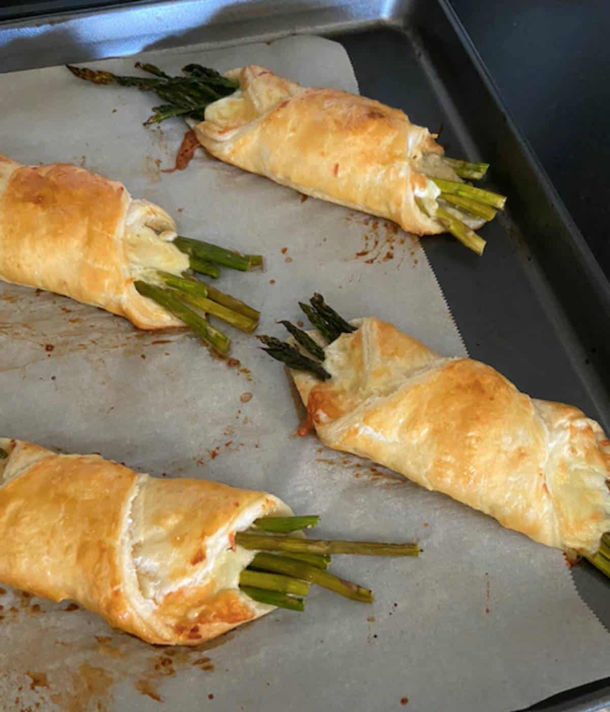Asparagus Puff Pastry baked on tray.