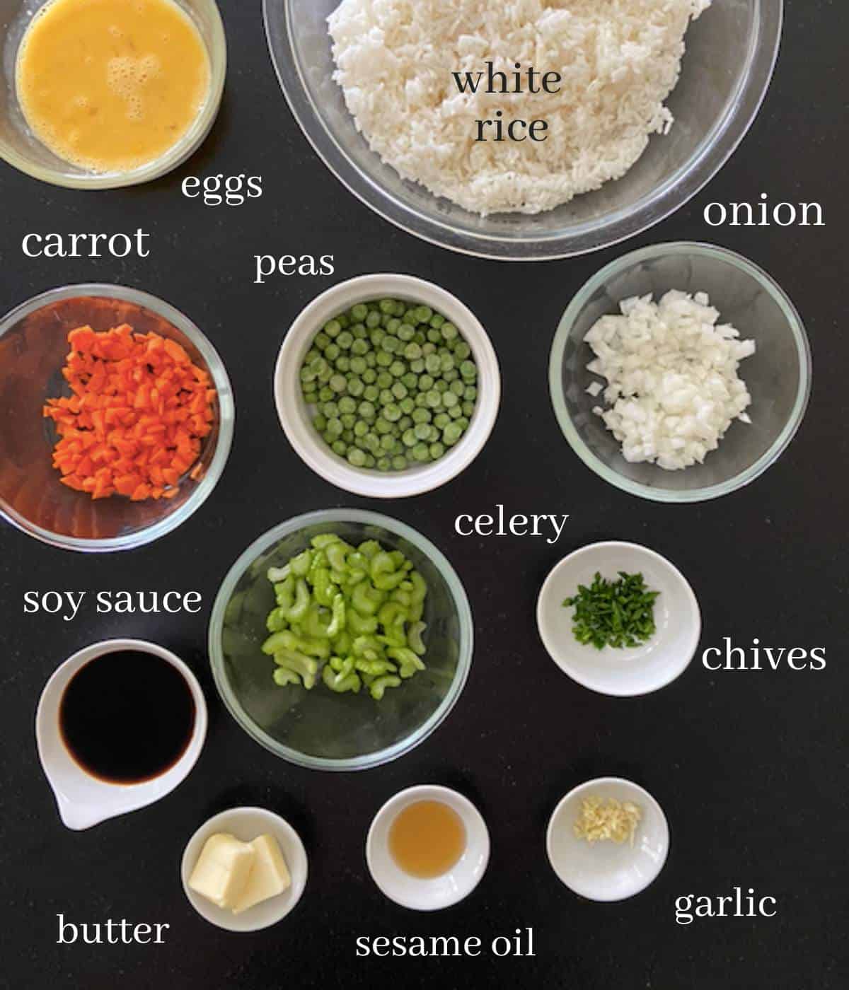 Ingredients for blackstone fried rice on black countertop.