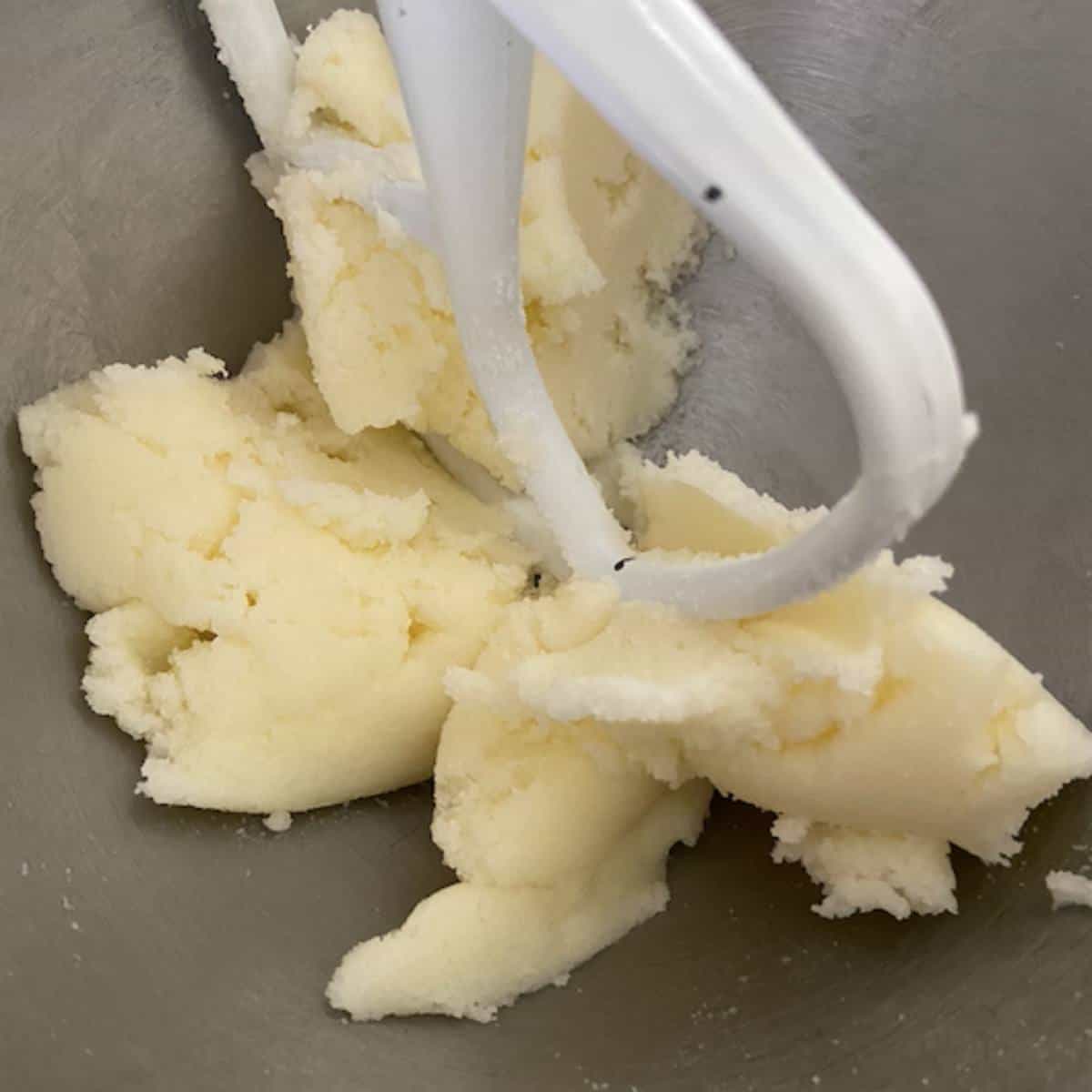 Sugar and butter creaming in stand mixer.