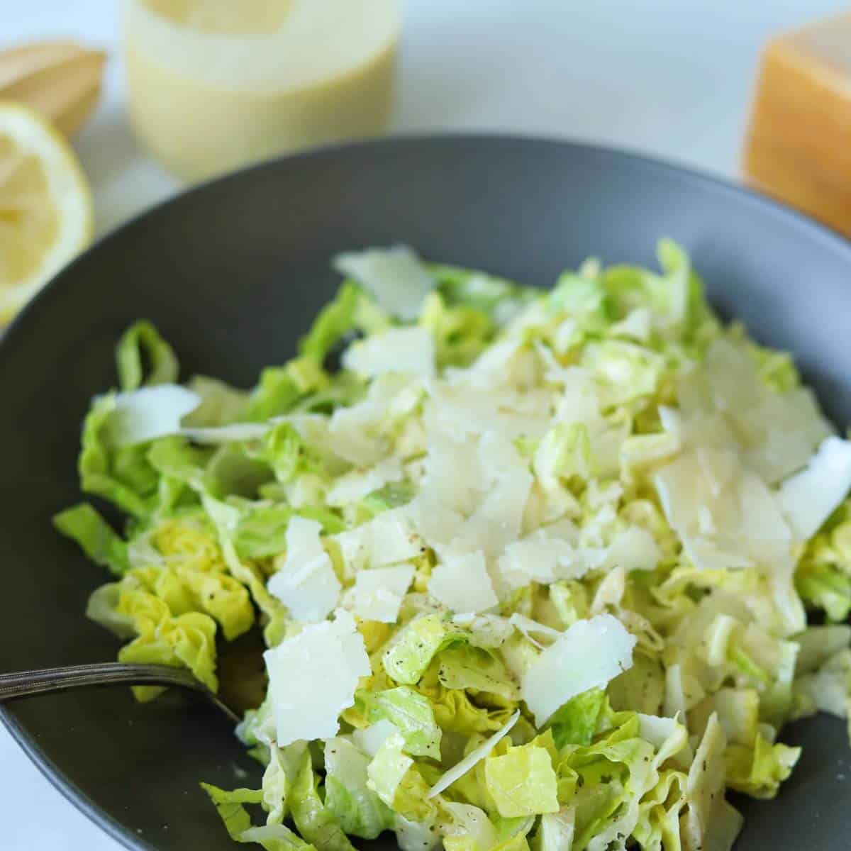 Caesar salad in bowl with fork.