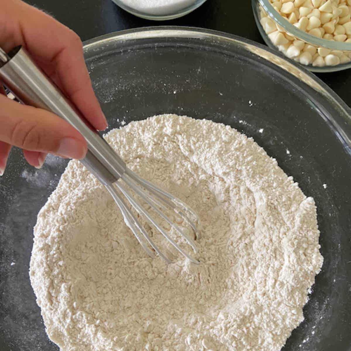 Hand mixing dry ingredients for muffins.