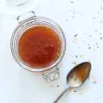 Hot honey in jar with spoon.