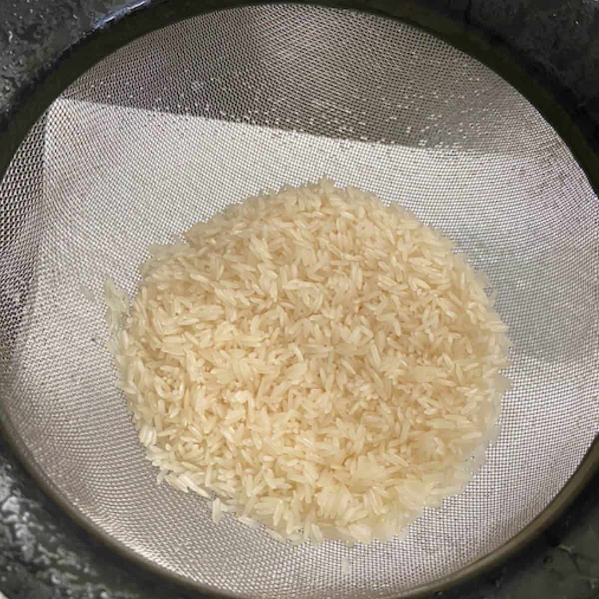 Rice after rinsed in colander.