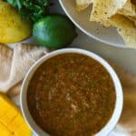 Mango Salsa is dish with tortilla chips and lime and mango.