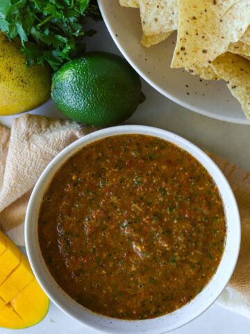 Mango Salsa is dish with tortilla chips and lime and mango.