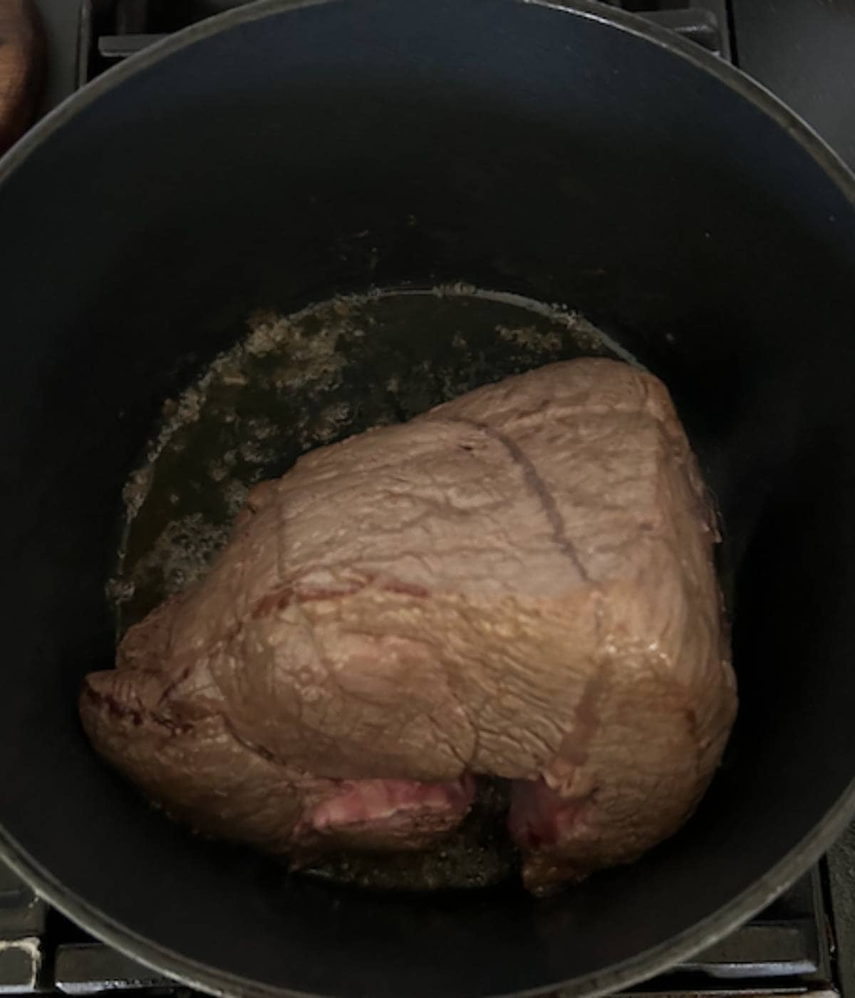 Sirloin roast searing in dutch oven.
