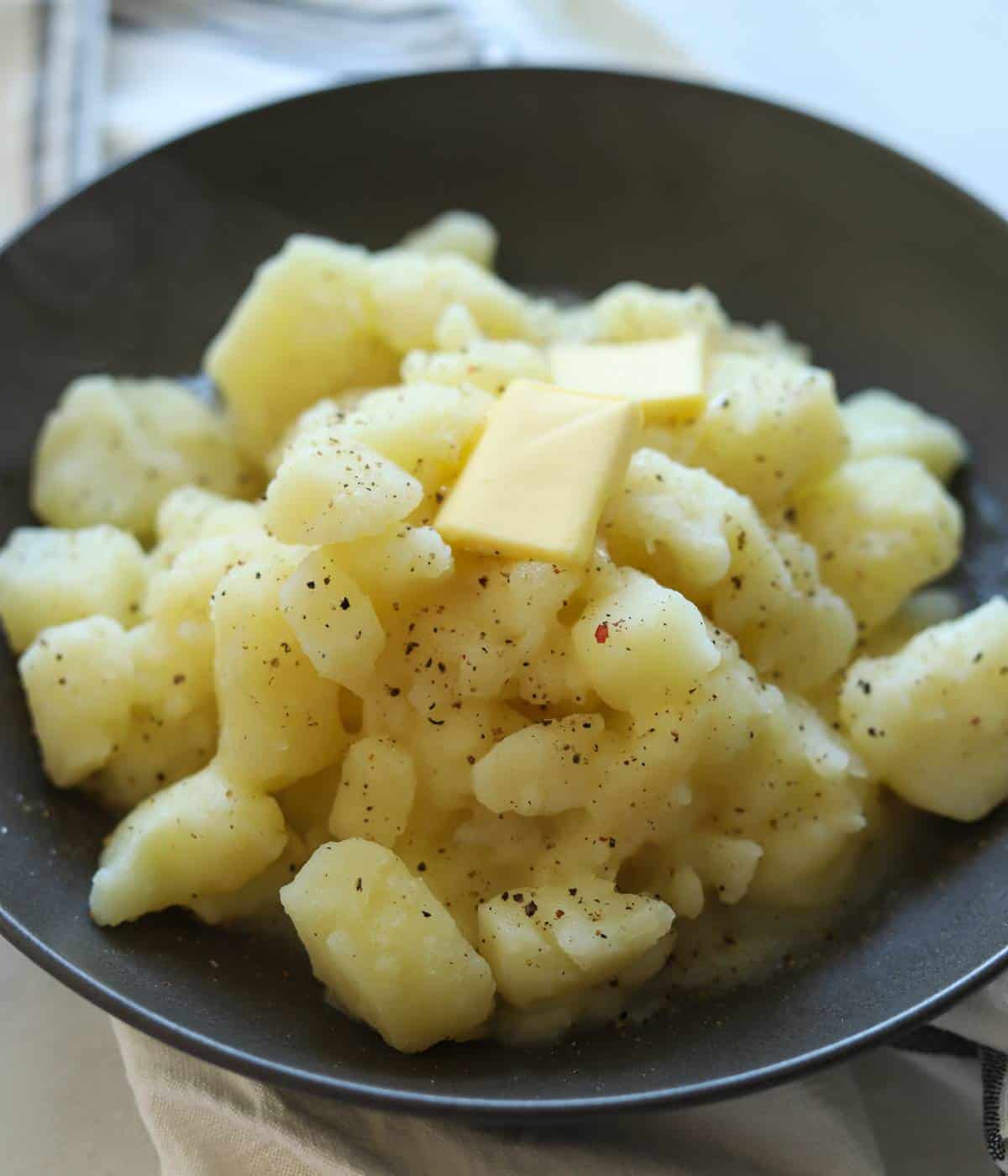 Stewed potatoes topped with butter, salt and pepper.