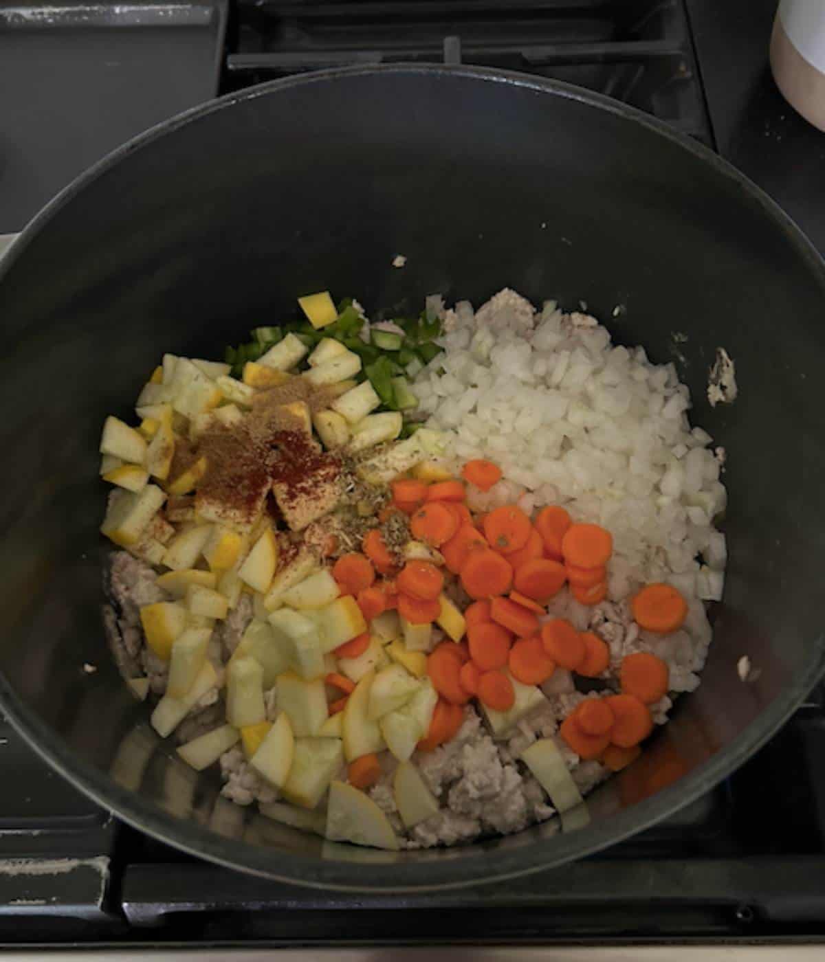 Turkey and vegetables in dutch oven.