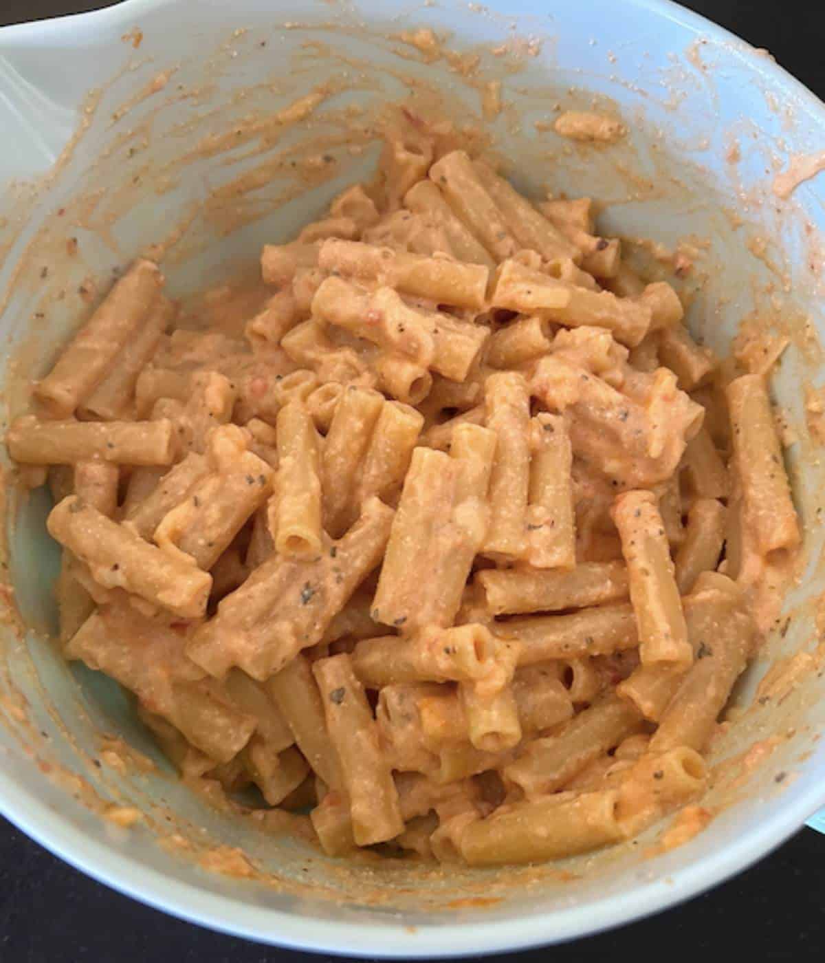 Ziti tossed in cheesy filling.