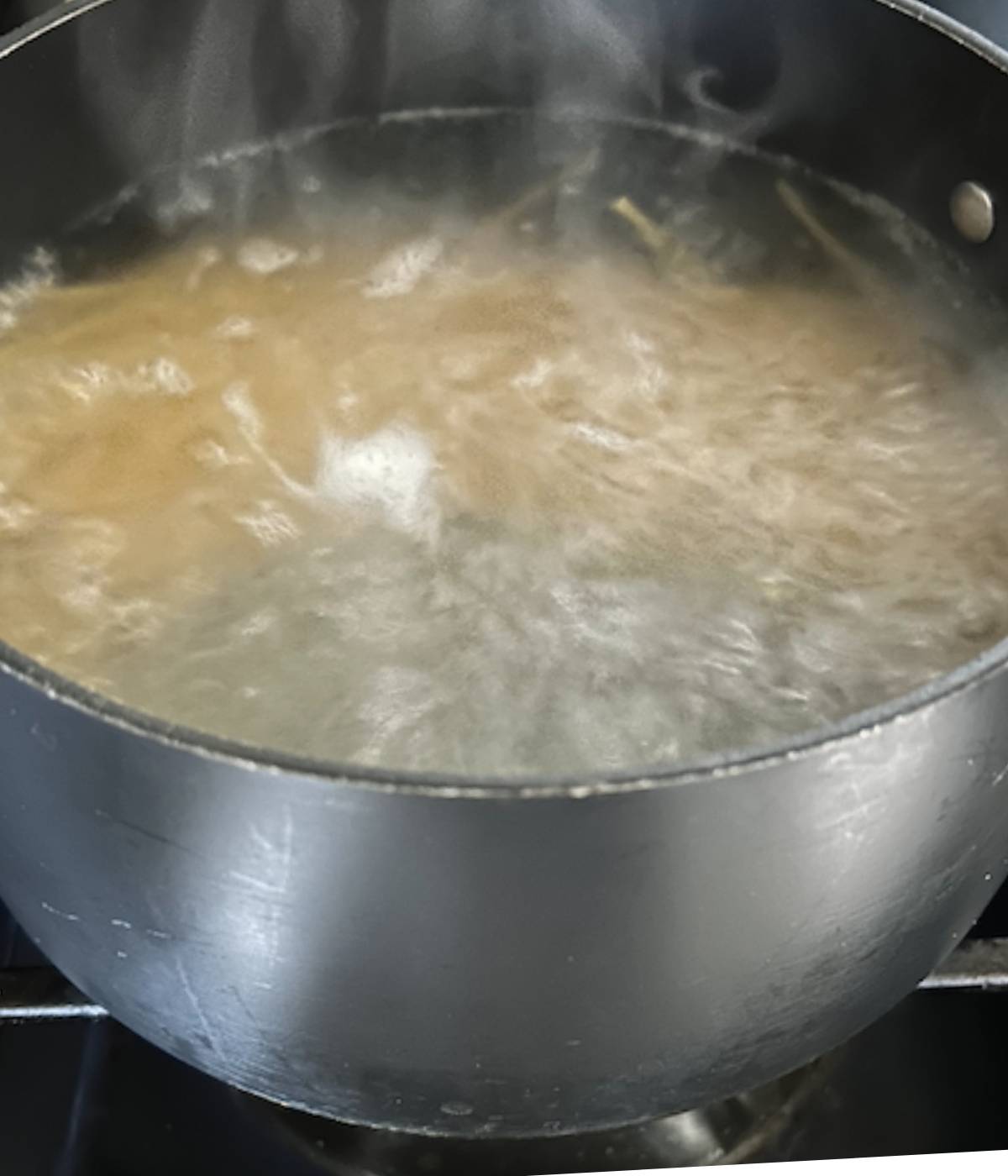 Linguine boiling in water.