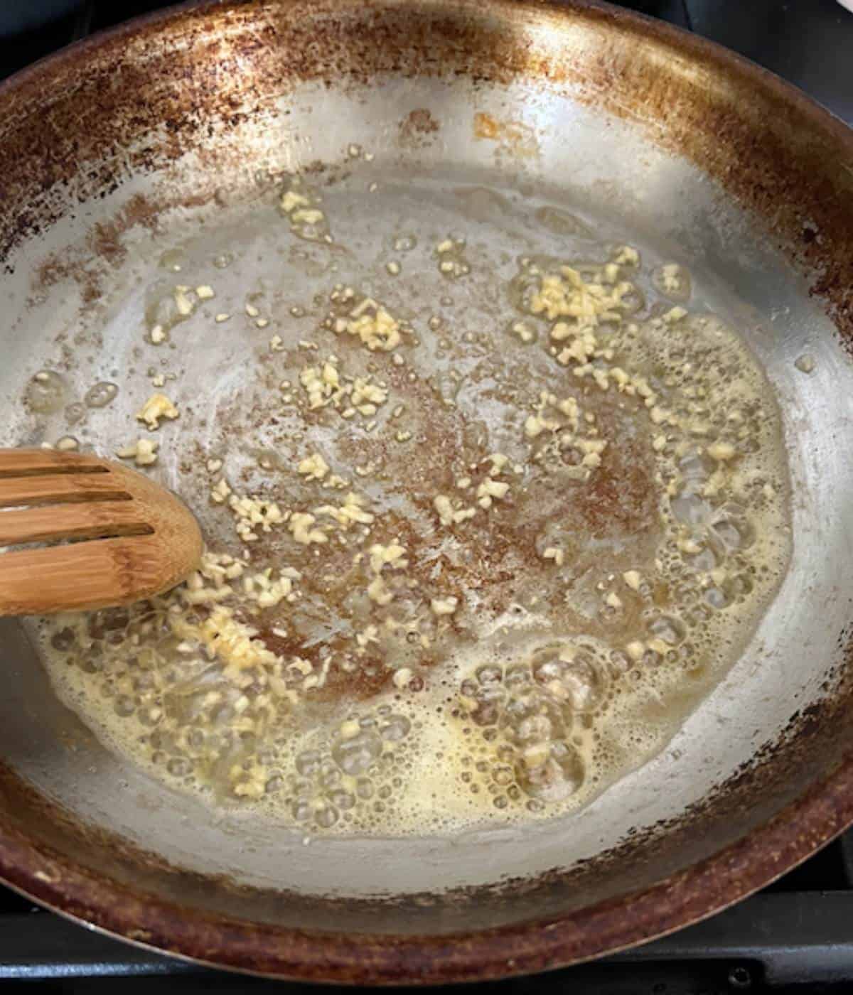 Garlic and butter cooking in skillet.
