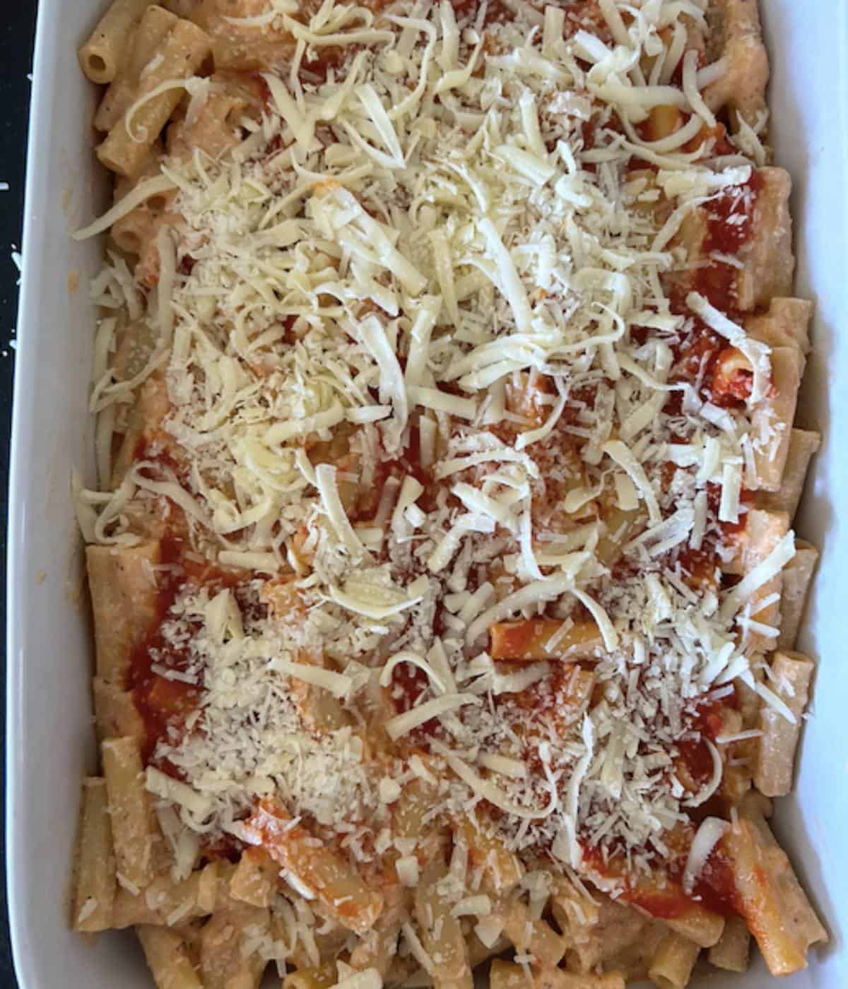 No meat baked ziti in casserole dish topped with cheese.