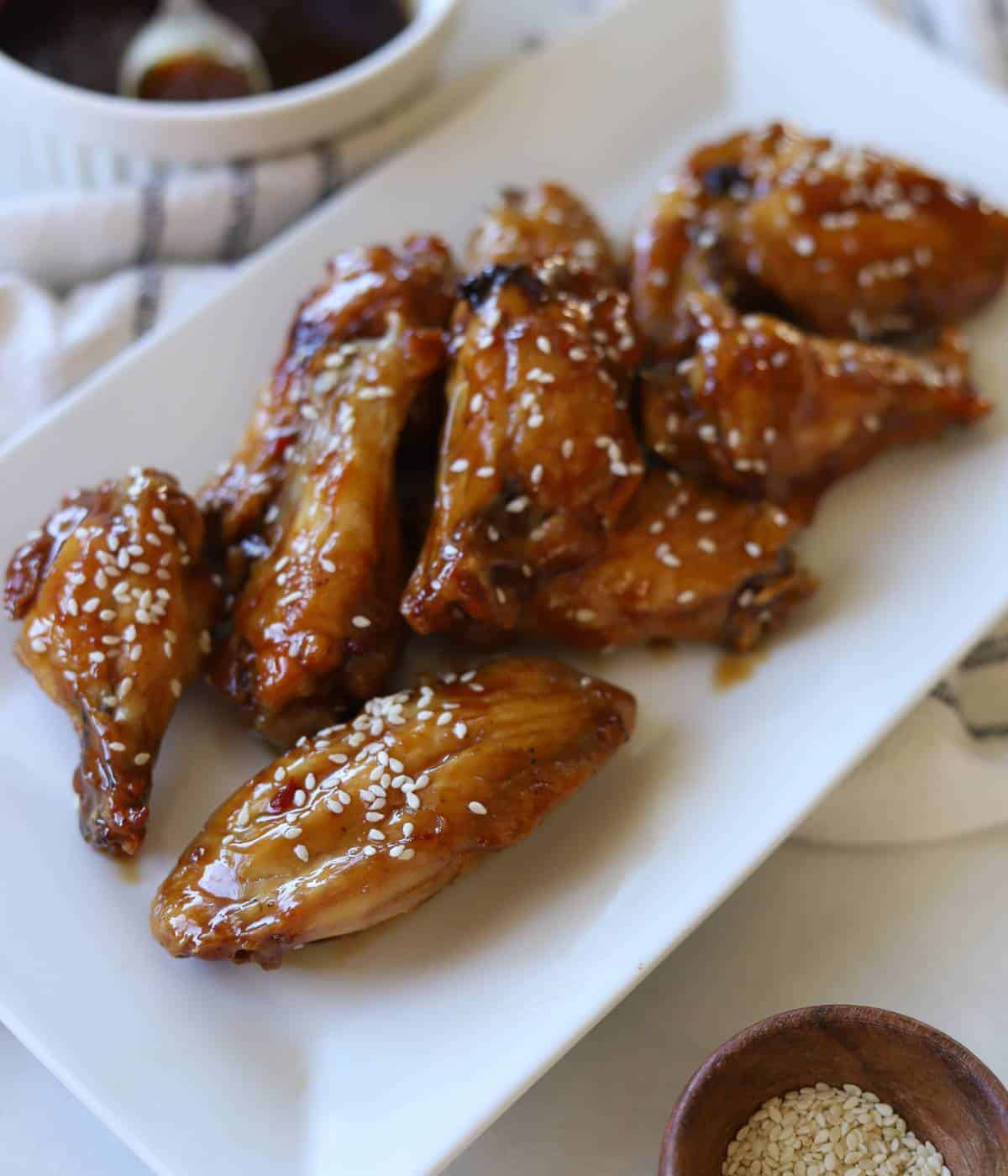 Garlic soy chicken wings on white plate.