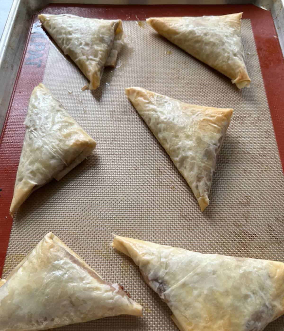 Baked apple turnovers with filo pastry.