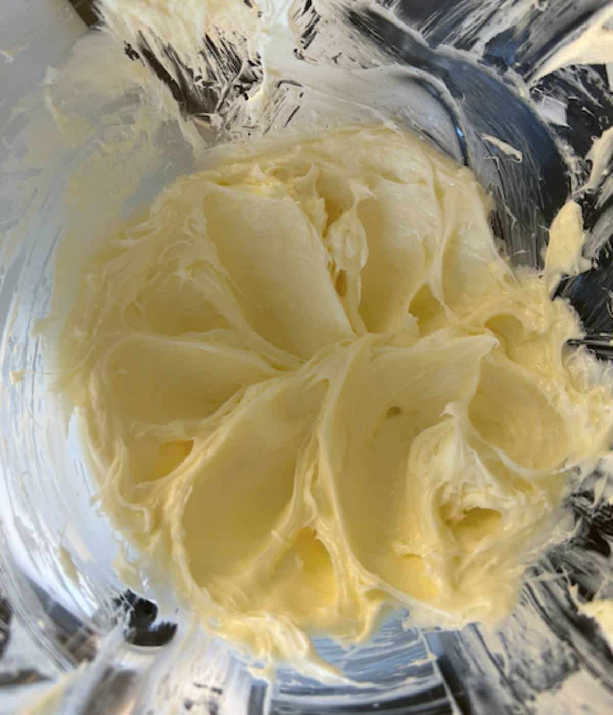Cream cheese and sugar in stand mixer.