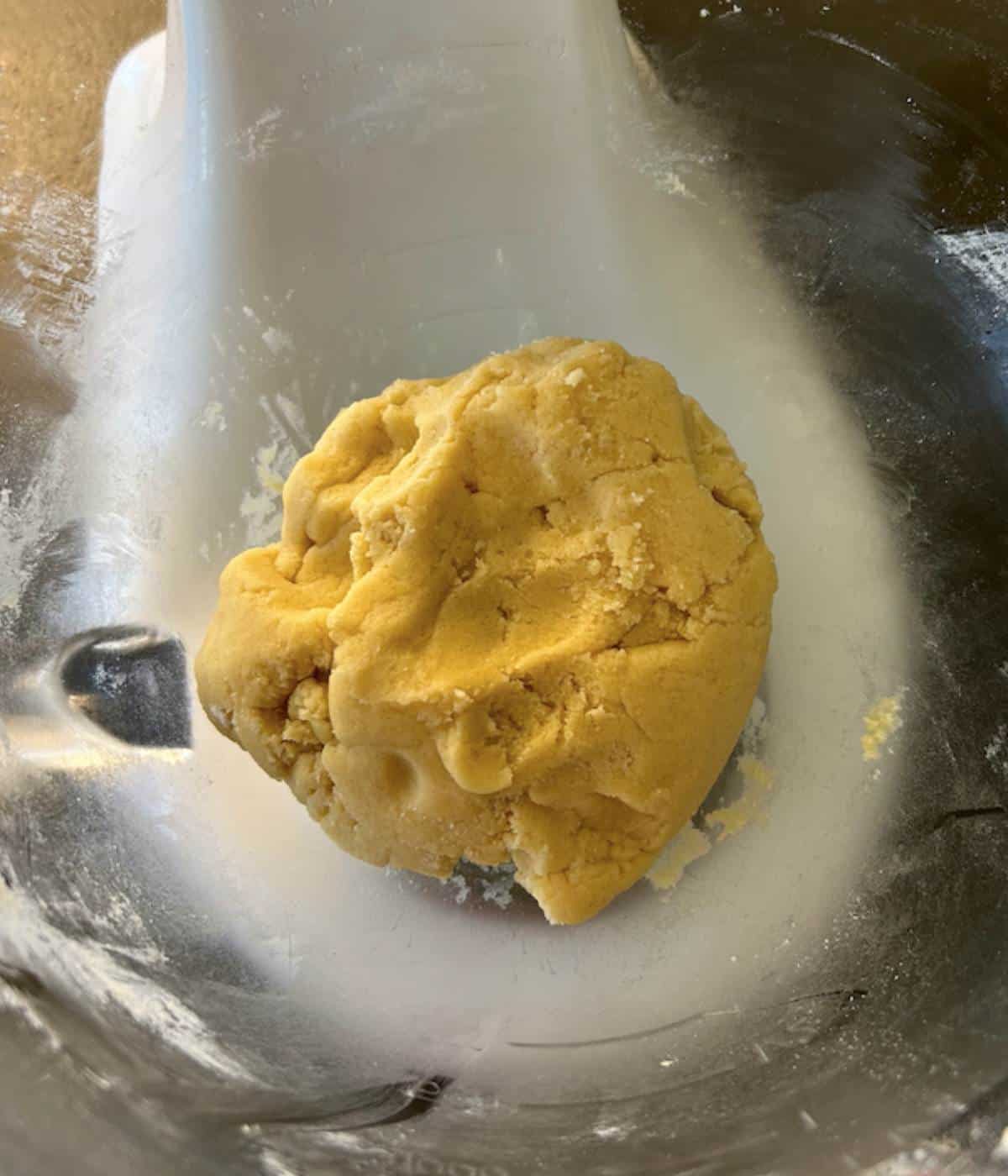 Thumbprint shortbread dough in bowl.