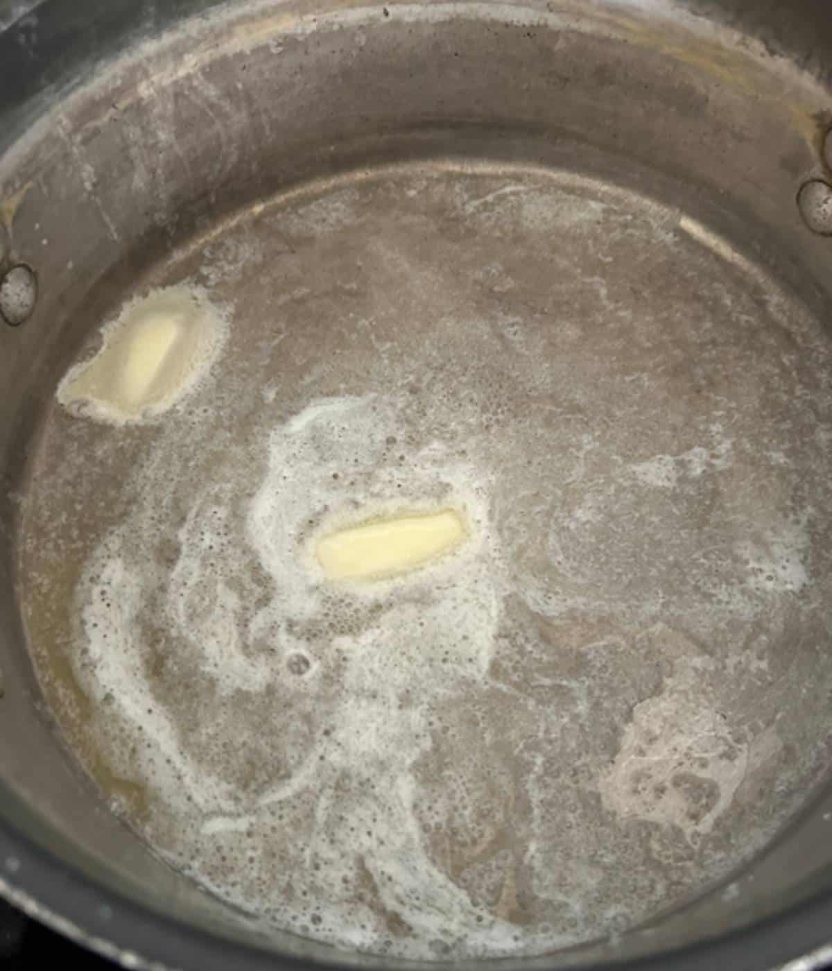 Butter melting in pan.