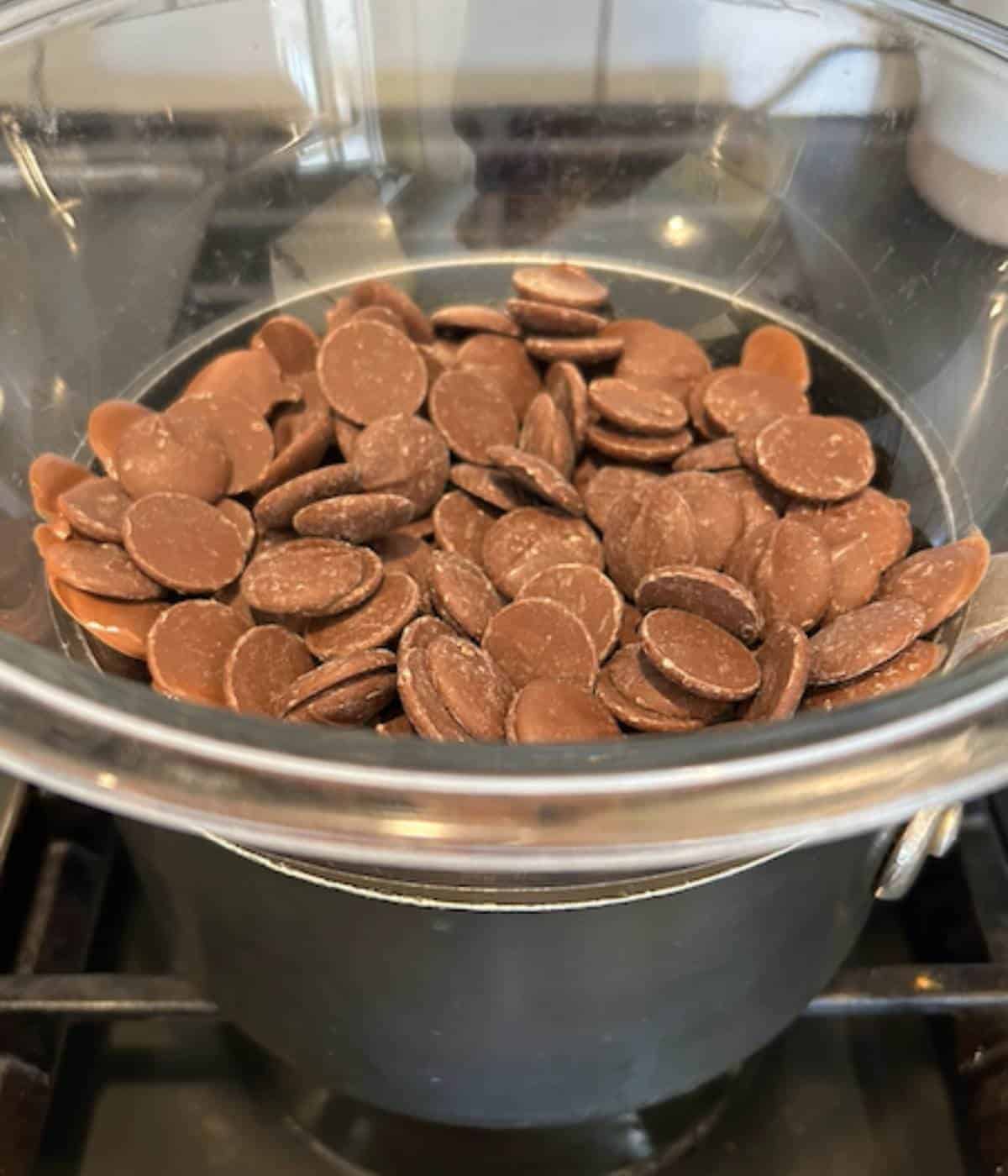 Melting milk chocolate wafers in double boiler. 