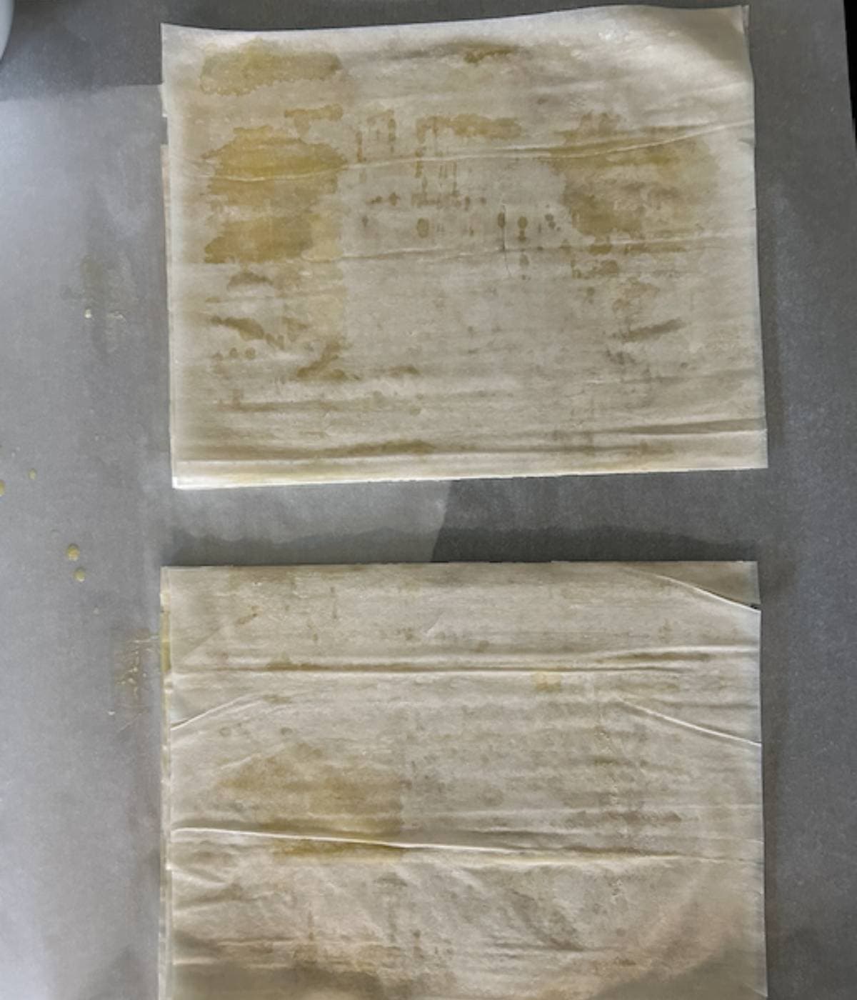 Phyllo sheets cut in two.