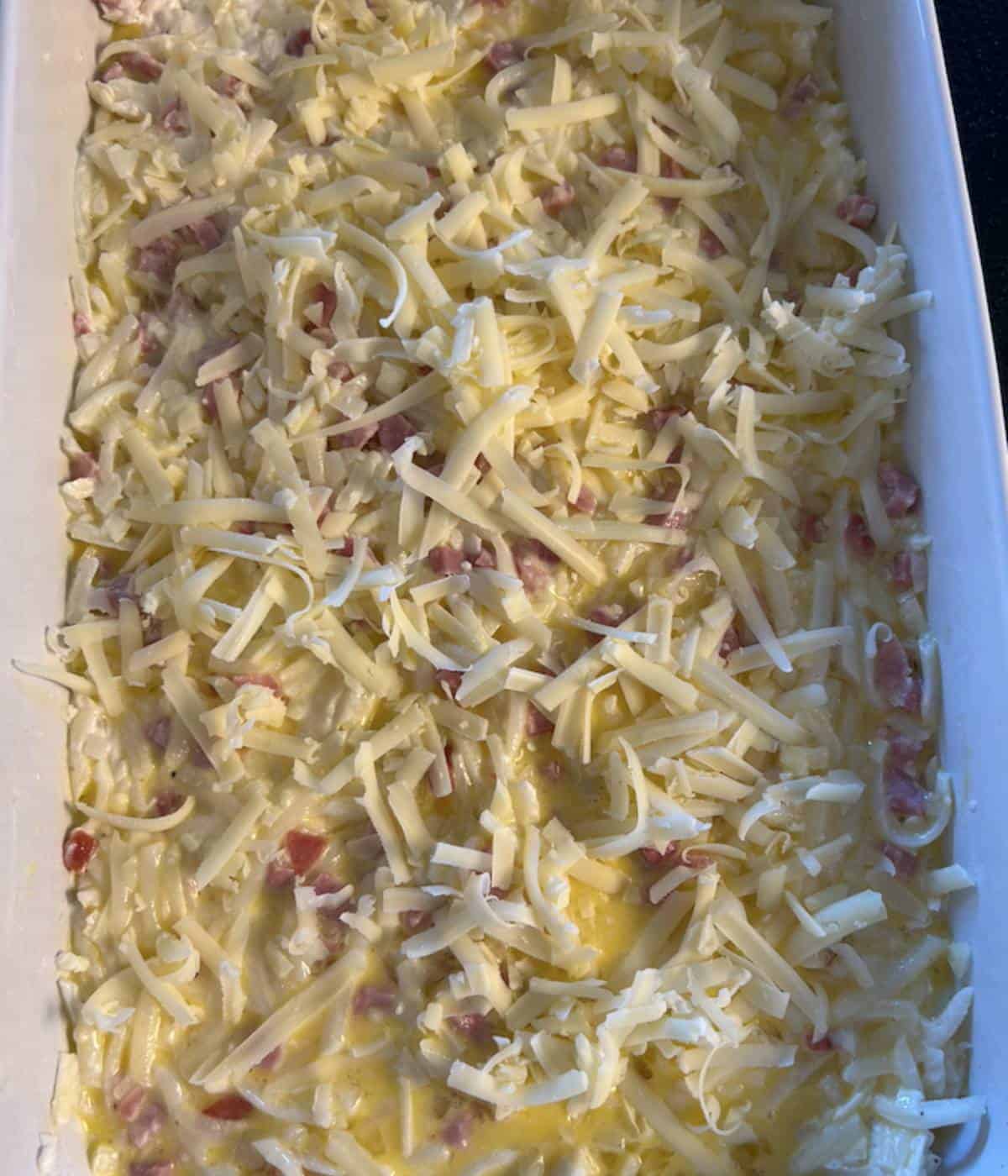 Breakfast Casserole with cheese ready to bake.