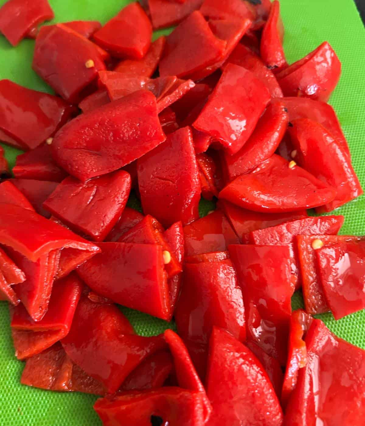 Roasted peppers cut into smaller squares.
