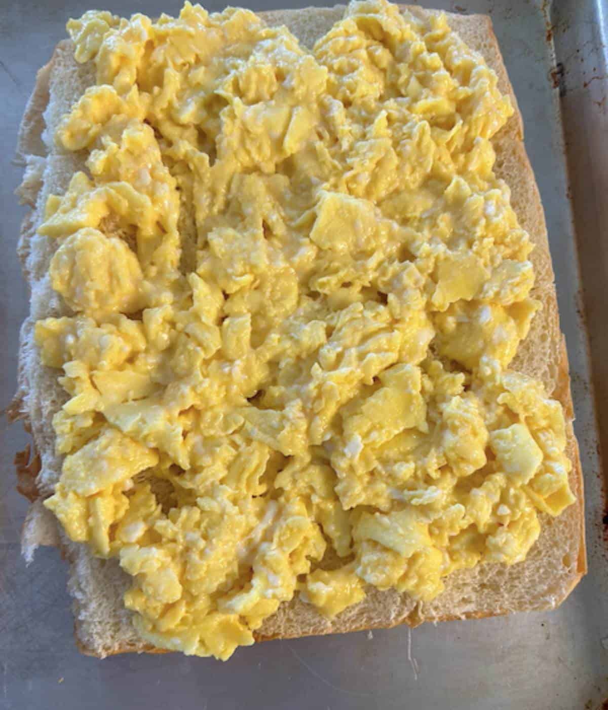 Scrambled eggs on bottom of sliders.