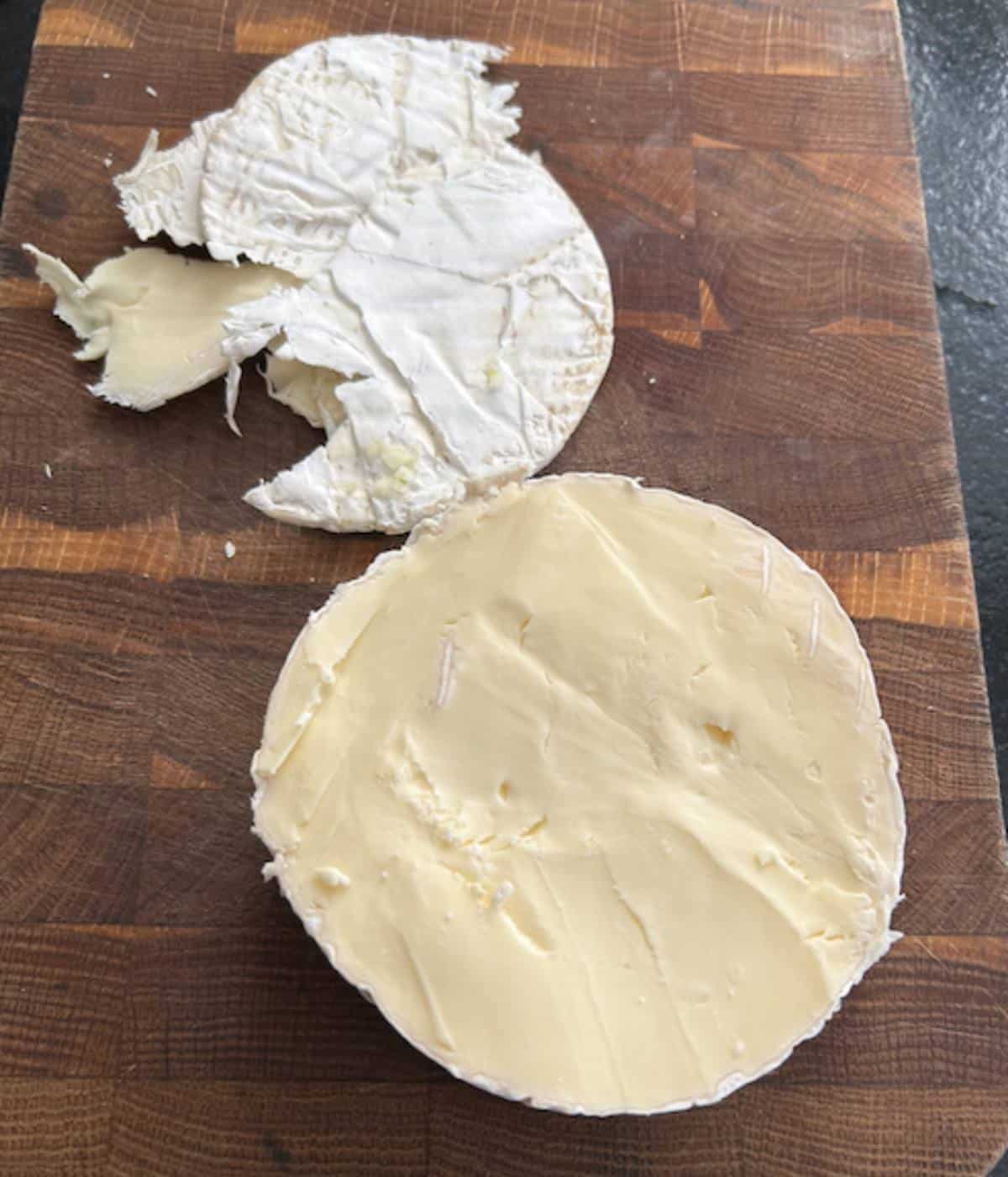 Rind shaved off top of brie.