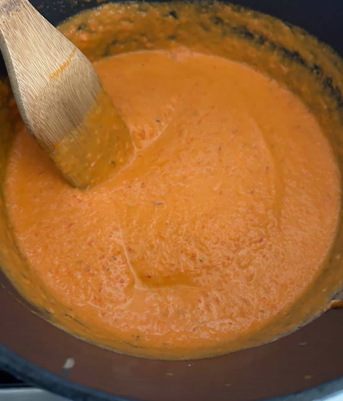 Creamy carrot sauce in dutch oven.