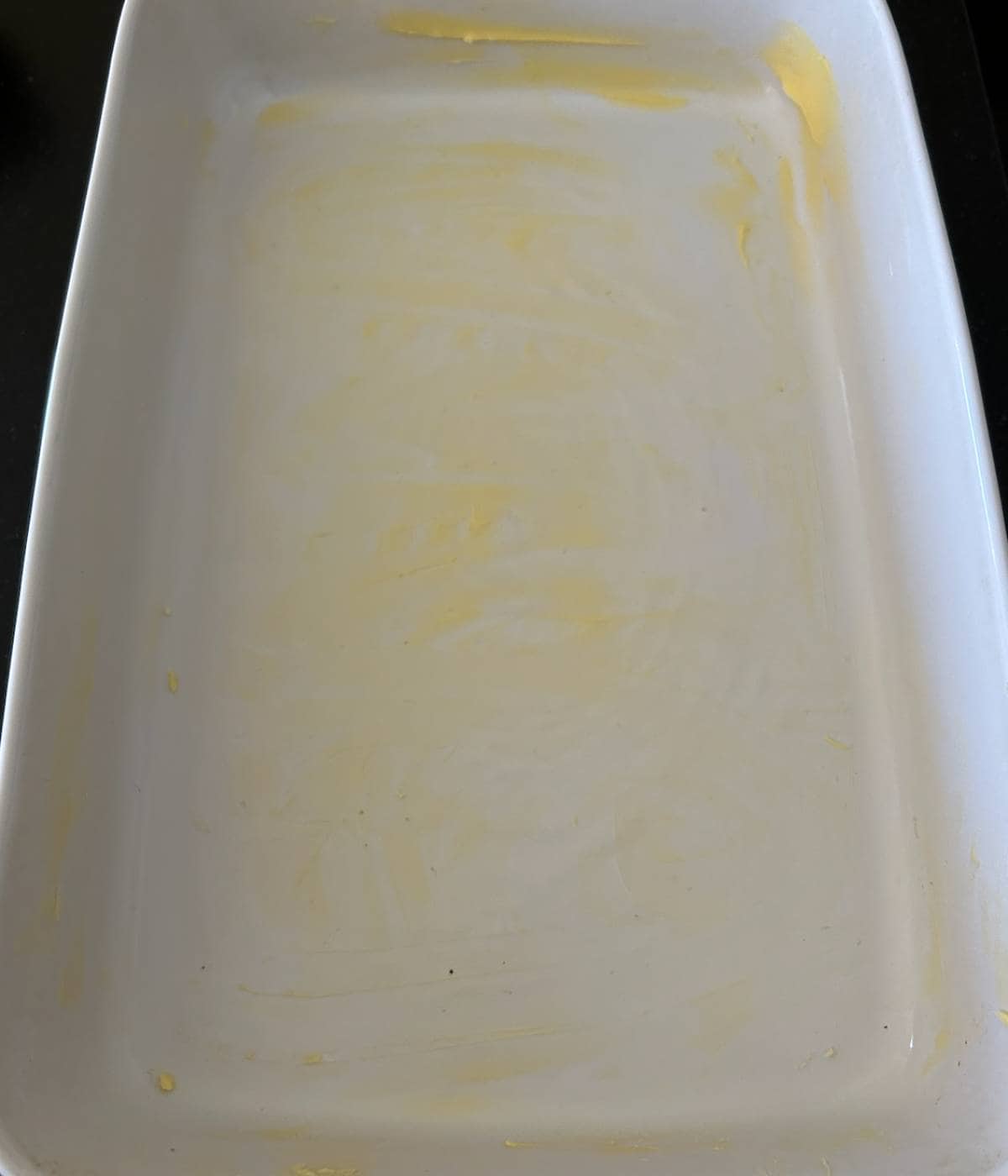 Greased casserole dish with butter.