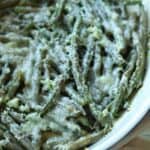 Roasted frozen green beans in dish.