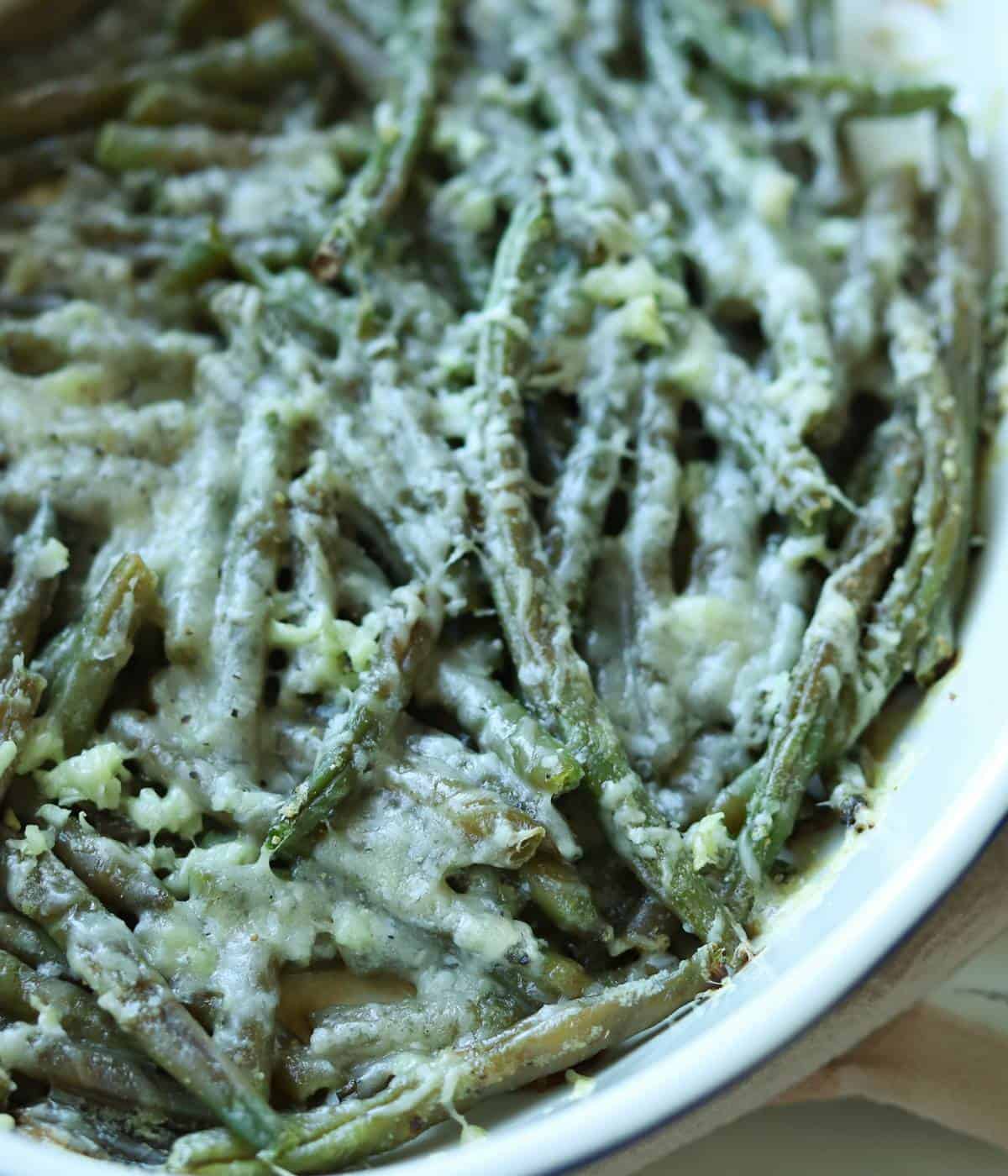 Roasted frozen green beans in dish. 