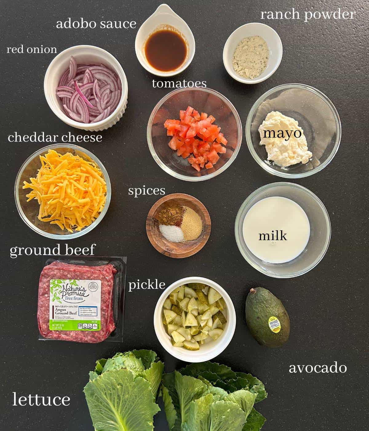 Ingredients for cheeseburger bowls on countertop.
