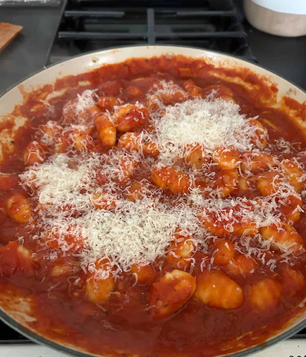 Gnocchi with marinara sauce and parmesan cheese.