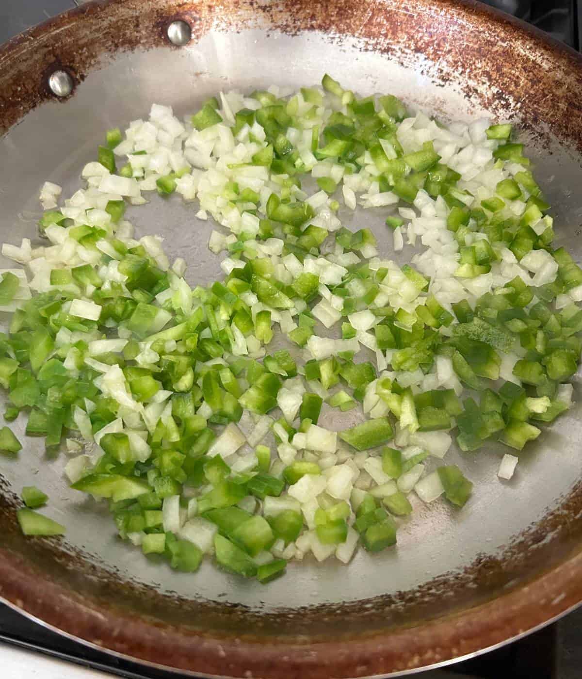 Peppers and onions in skillet.