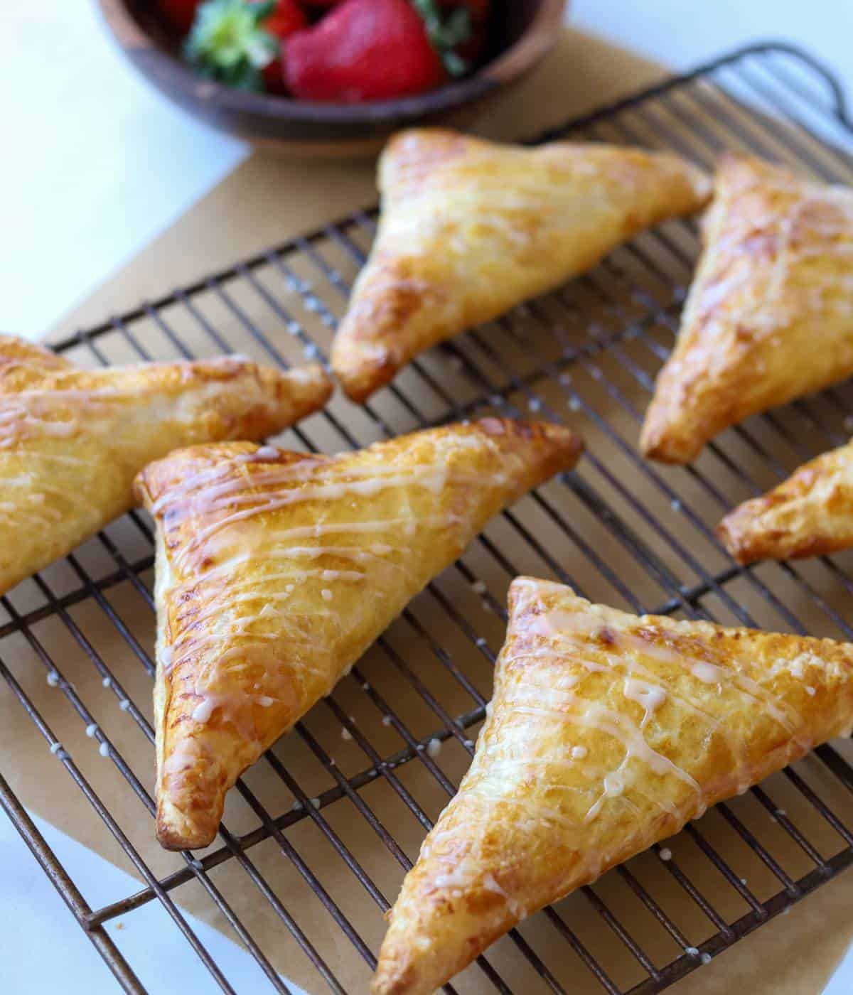 Strawberry turnover pastries on tray.