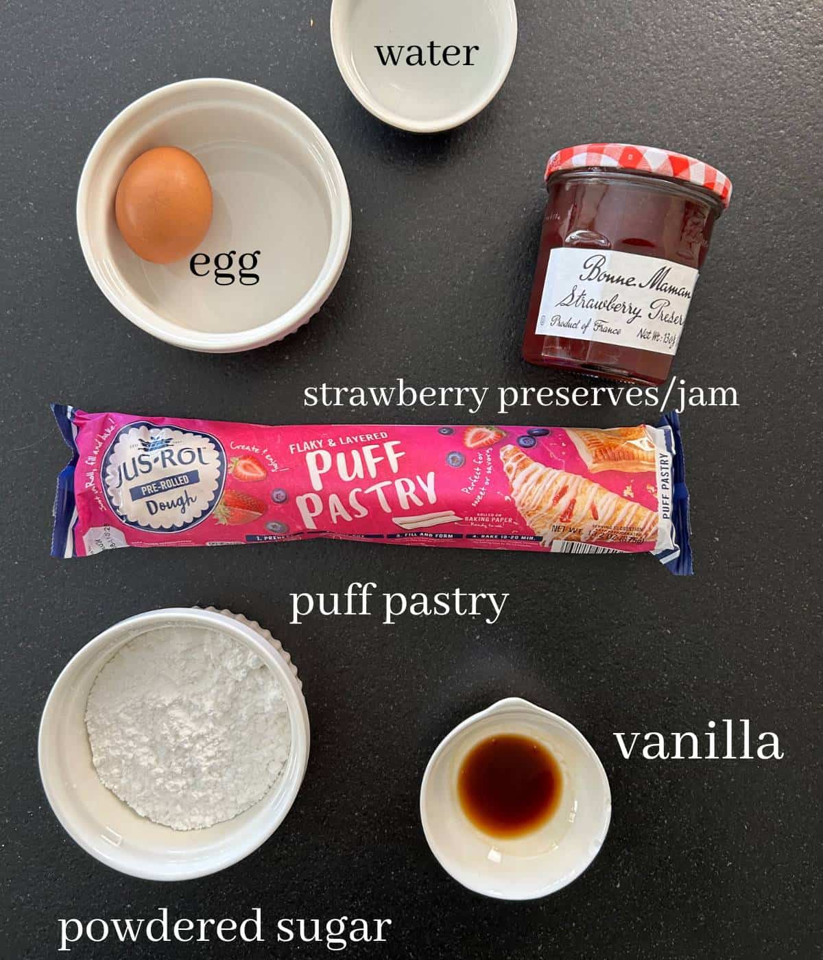 Ingredients for strawberry pastries on counter.
