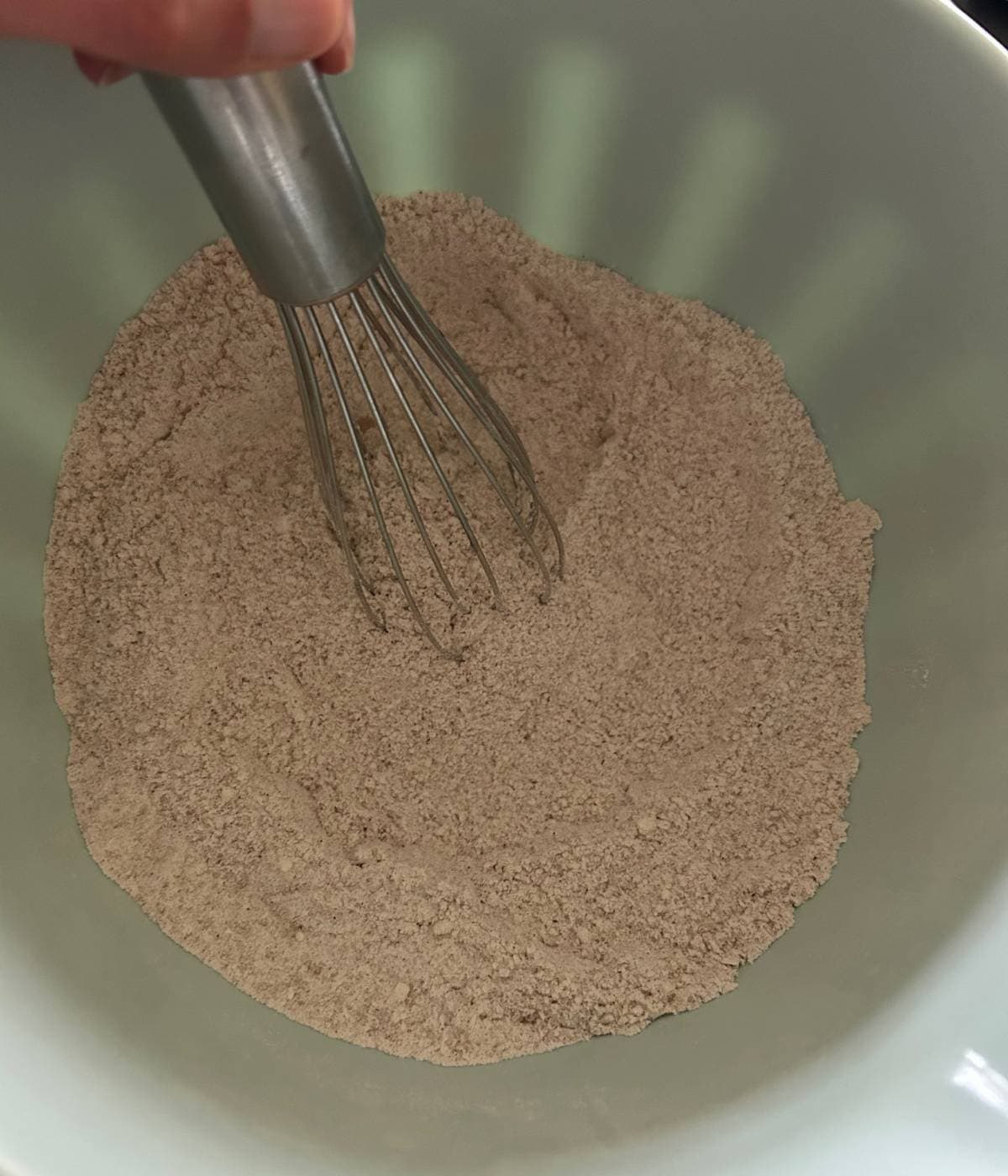 Dry ingredients for muffin batter in bowl.