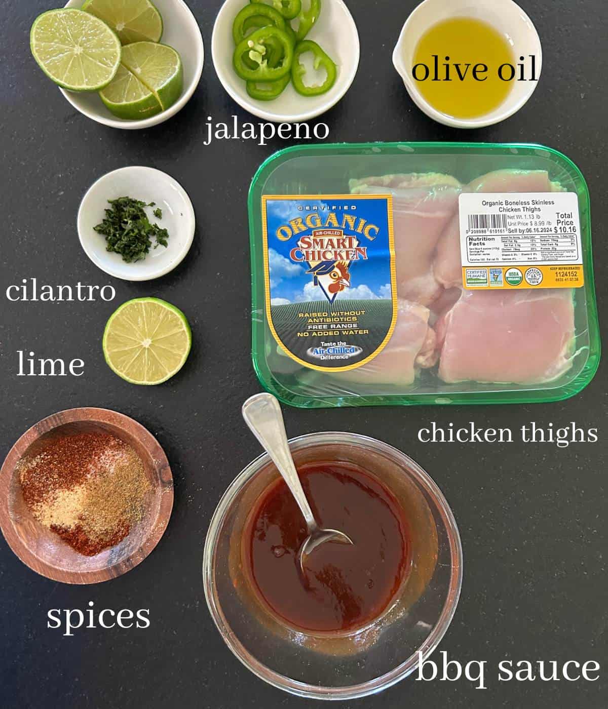 Ingredients for boneless chicken thighs on countertop.