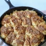 Peach cobbler in a cast iron skillet.