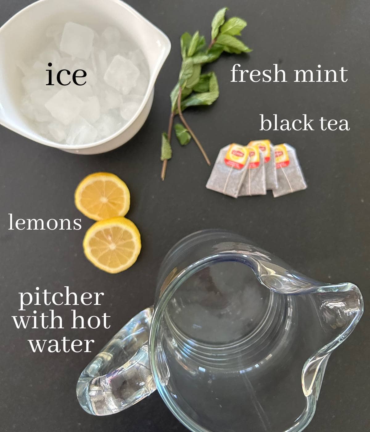 Ingredients for mint tea on countertop.