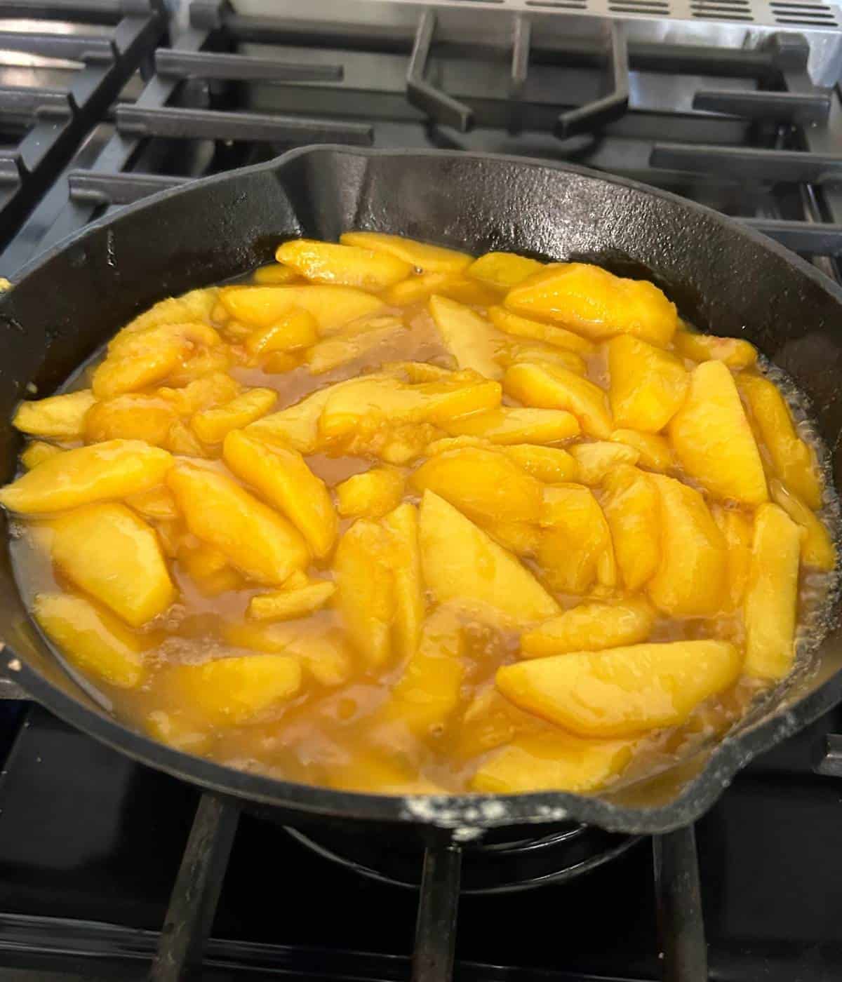 Fresh peaches in sauce.