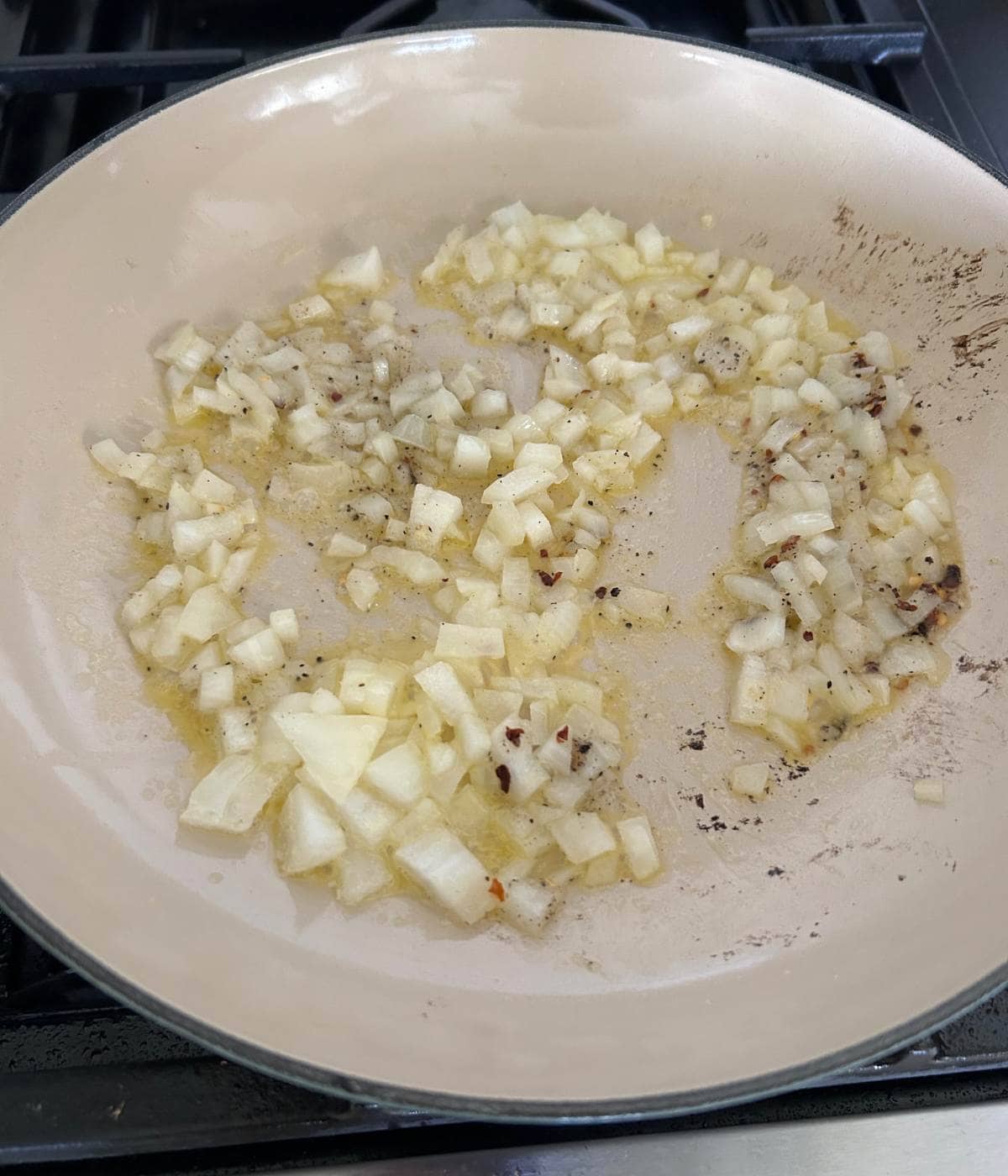 Onions softening in skillet.