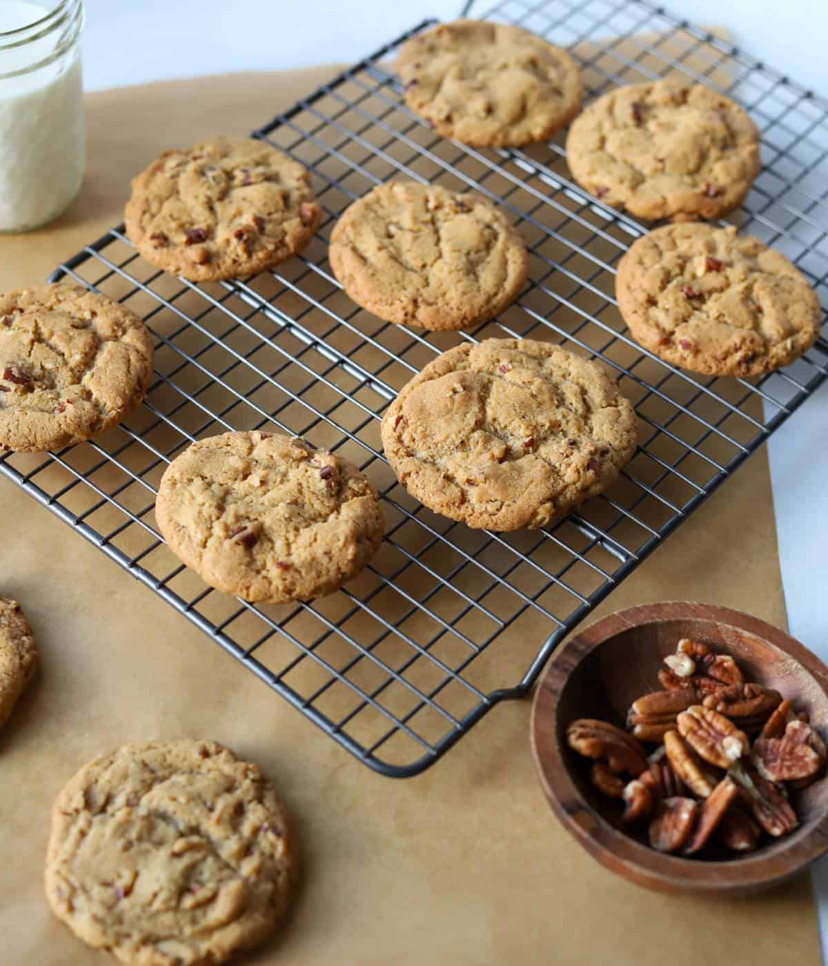 Brown butter pecan cookies on baking rack.