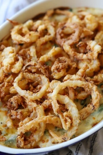Green bean casserole topped with fried onions.