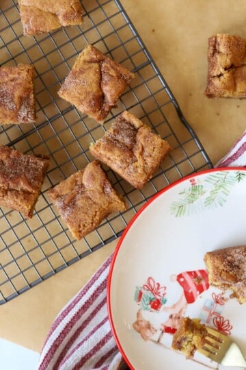 Snickerdoodle cookie bars on baking rack and plate.