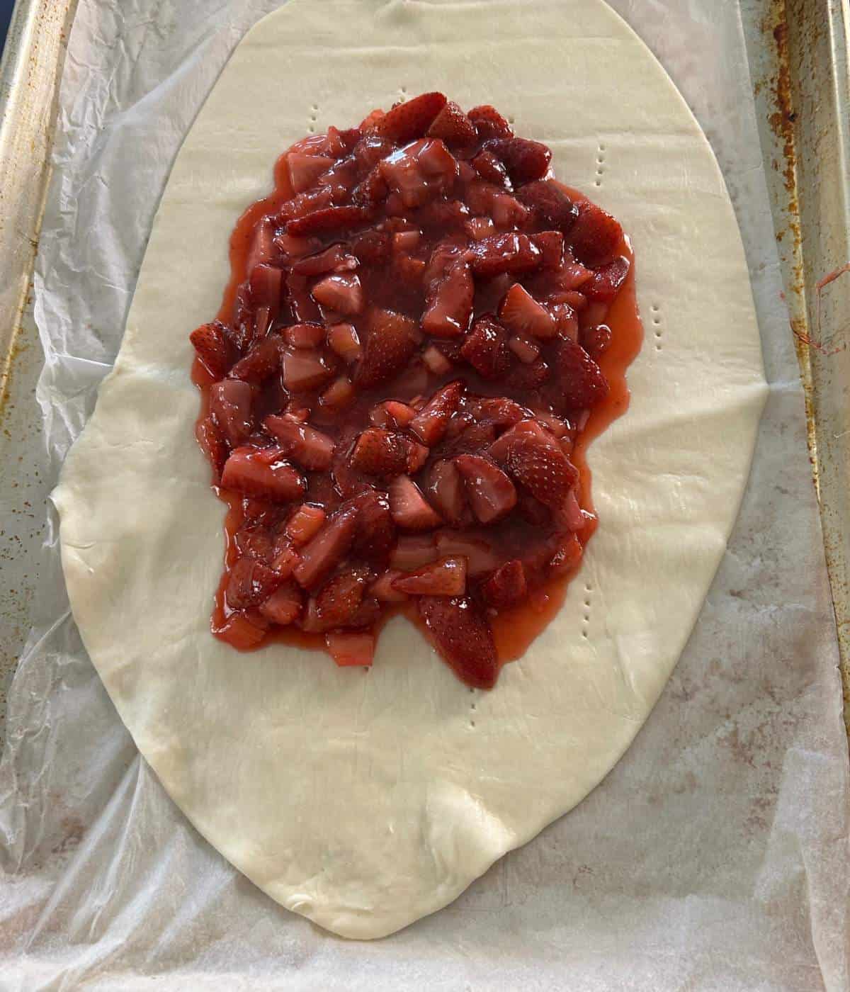 Fruit filling inside puff pastry.