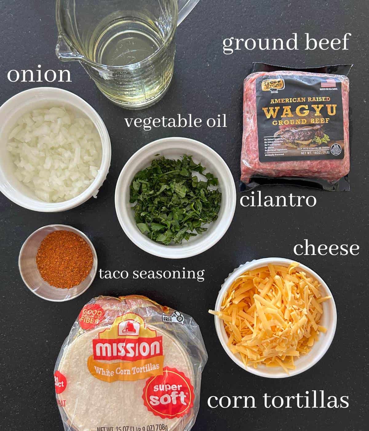 Ingredients for crispy beef tacos on counter.