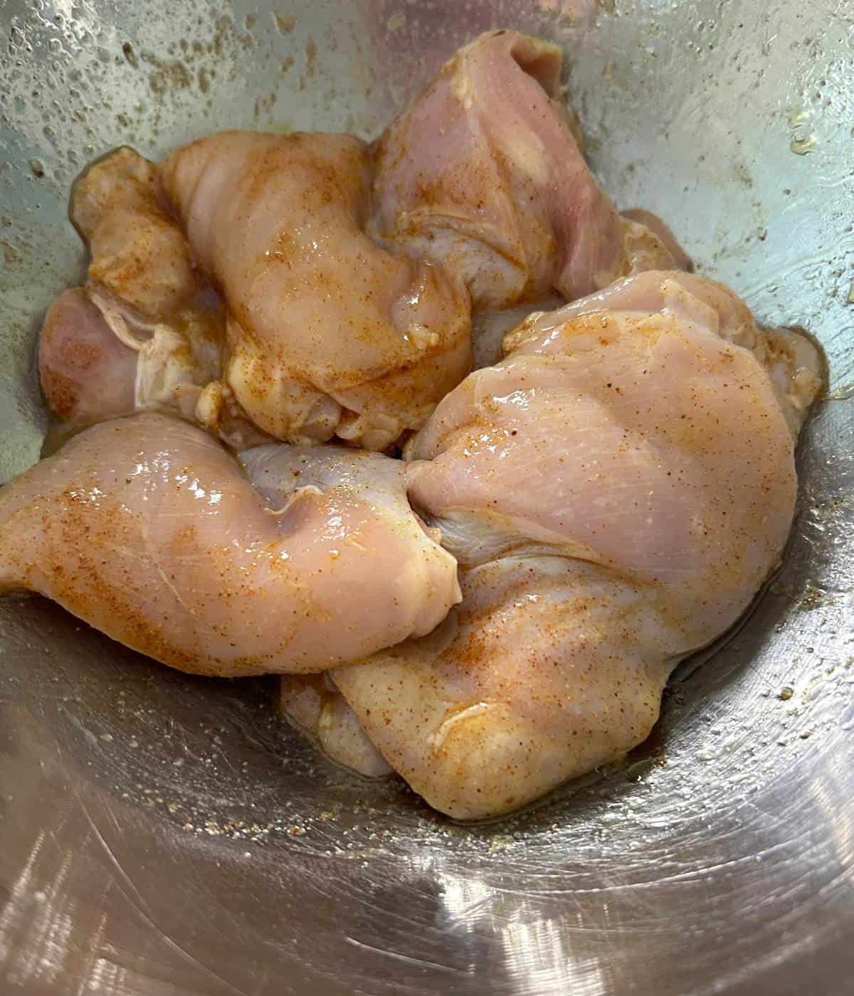 Marinated chicken thighs with spices.